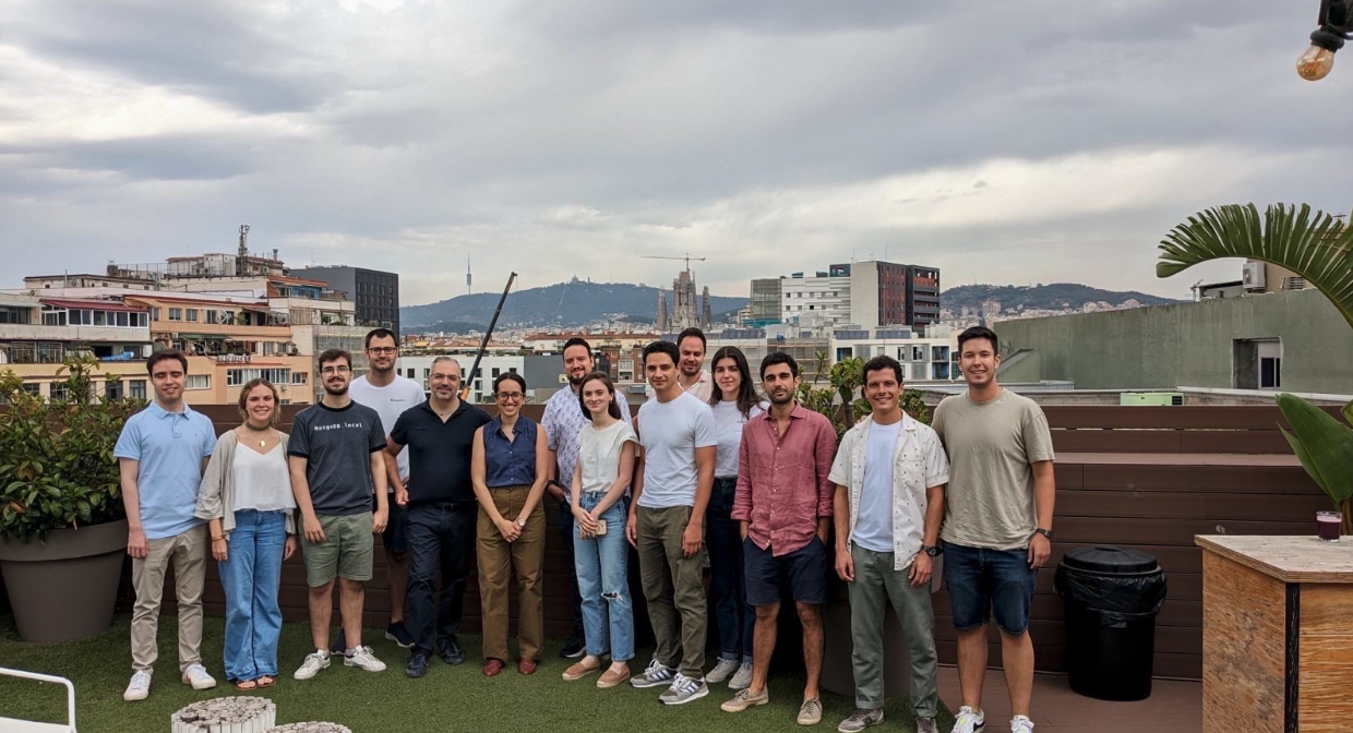 Photo of some of the MongoDB industry solutions team members standing on the roof for the MongoDB Barcelona office
